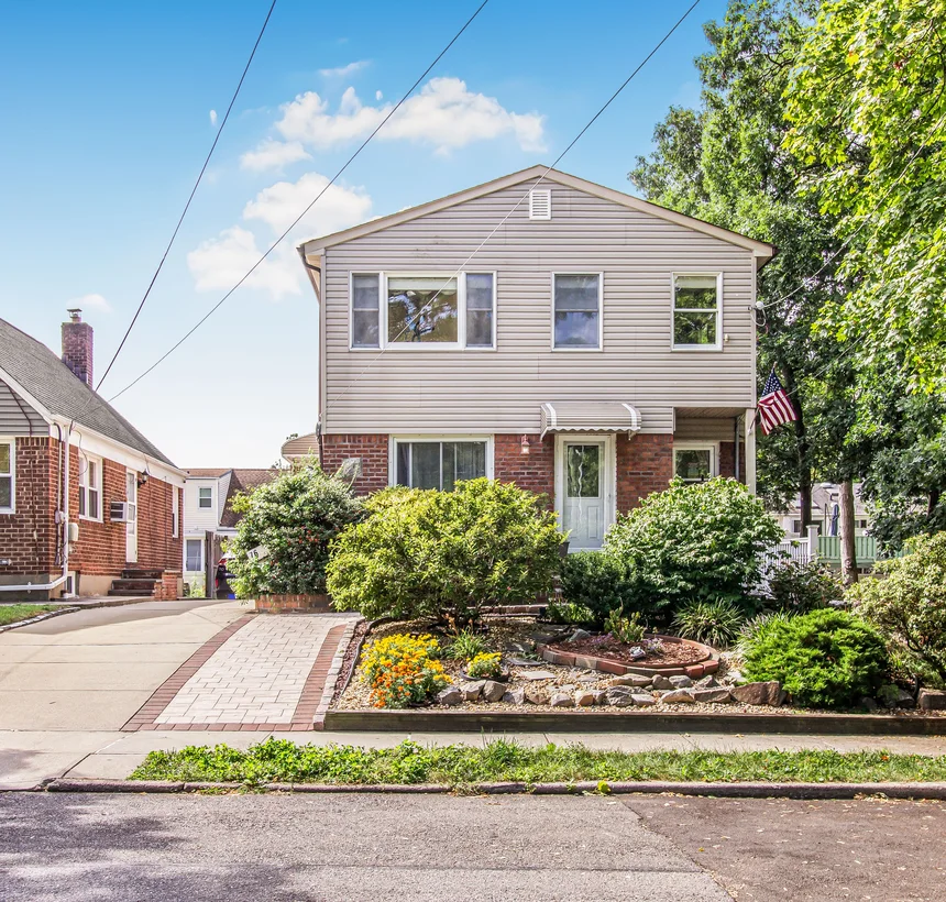 Semi-detached home with brick and siding on a residential street in Baltimore County