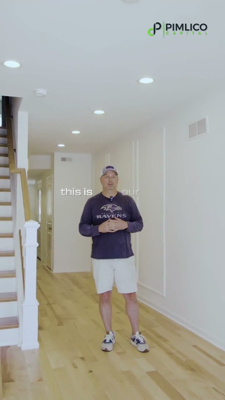 Investor touring a finished Baltimore renovation funded by Pimlico Capital